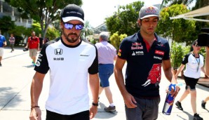 Fernando Alonso (l.) startet in Sepang zum ersten Mal im Jahr 2015