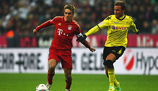 Philipp Lahm (l.) gibt sich vor dem Spiel gegen Dortmund kämpferisch