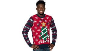 Alphonso Davies präsentiert den Ugly Christmas Sweater des FC Bayern München. Und auch die Bayern ...