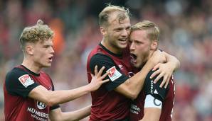Hanno Behrens, Johannes Geis und Robin Hack wollen mit dem 1. FC Nürnberg auch gegen Regensburg jubeln und wichtige Punkte im Kampf um den Klassenerhalt einfahren.