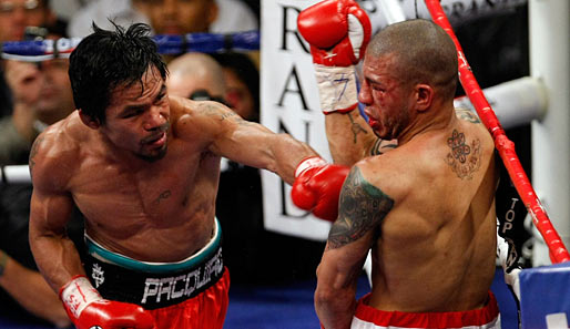 Am 14. November 2009 besiegte Manny Pacquiao (l.) Miguel Cotto durch technischen K.o.