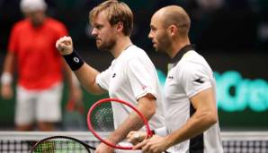 Die deutschen Tennisprofis haben sich fürs Viertelfinale im Davis Cup qualifiziert. Im Gruppenfinale gegen Österreich musste das Team aber erst zittern.