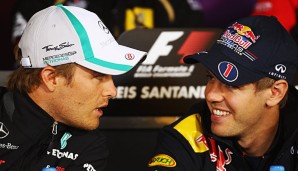 Sebastian Vettel (l.) stärkt Nico Rosberg den Rücken