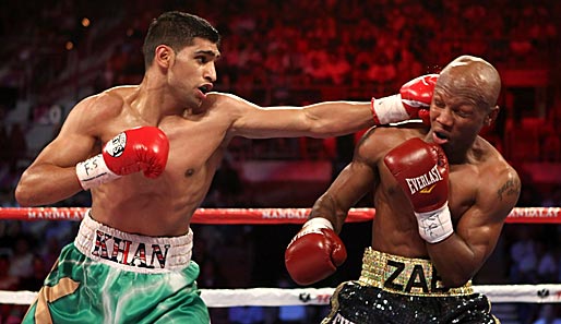 Amir Khan (l.) knockte Zab Judah aus und vereinigte die Titel von WBA und IBF