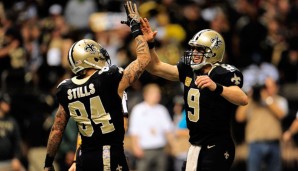 Drew Brees (r.) gelangen gegen die Cowboy vier Touchdown-Pässe