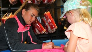 MELBOURNE, AUSTRALIA - JANUARY 21: Vera Zvonareva of Russia signs autographs during the 2015 Australian Open at Melbourne Park on January 21, 2015 in Melbourne, Australia. (Photo by Patrick Scala/Getty Images)